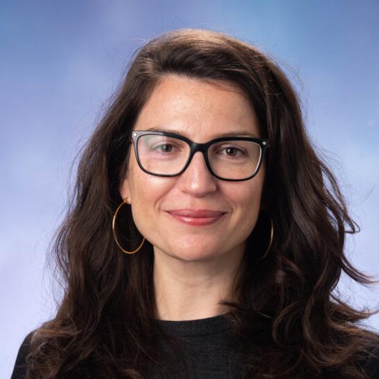 A headshot photo of Assistant Professor Eralda Lameborshi wearing a dark shirt.